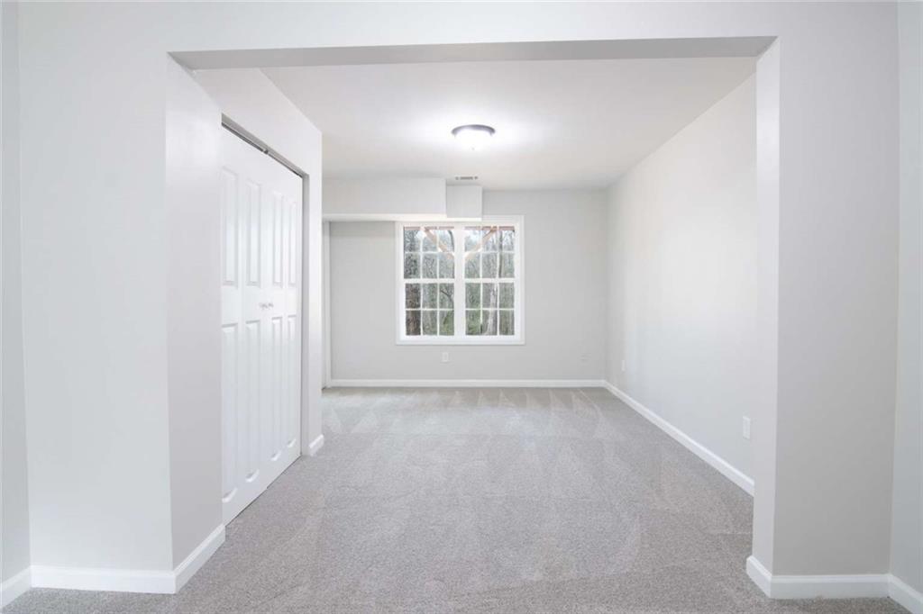 824 Eastmont Road Winder, GA 30680 - Photo 32 of 35 an empty room with windows and closet