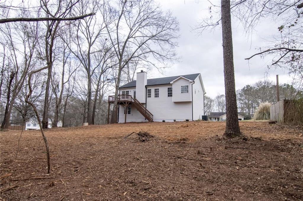 824 Eastmont Road Winder, GA 30680 - Photo 9 of 35 a view of a house with a snow in front of yard