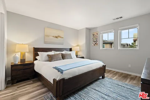 a bedroom with bed and window