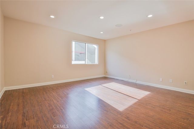 a bathroom with a double vanity sink a toilet and shower