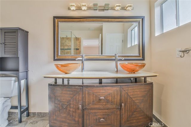 a bathroom with a shower and toilet