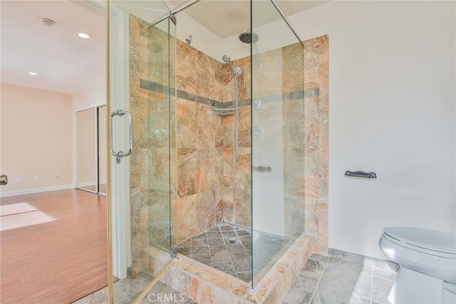 a kitchen with lots of counter top space and wooden floor