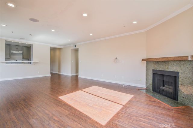 a view of kitchen with a sink and a refrigerator