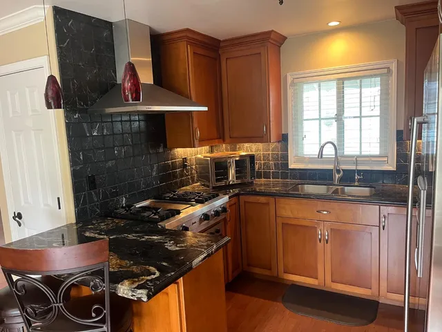 a kitchen with a stove and a sink