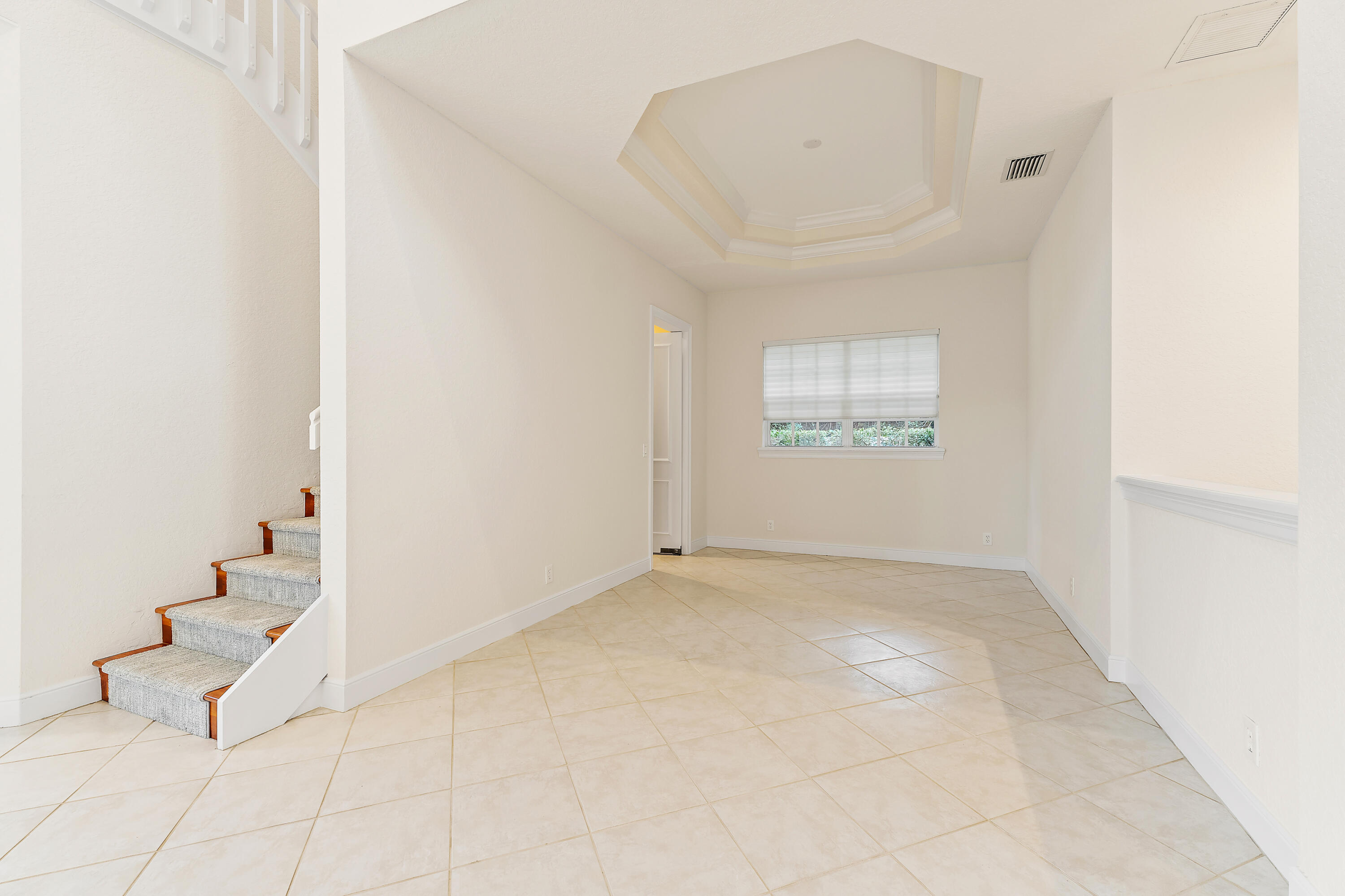 111 Fishermans Way Jupiter, FL 33477 - Photo 12 of 57 an empty room with windows and stairs