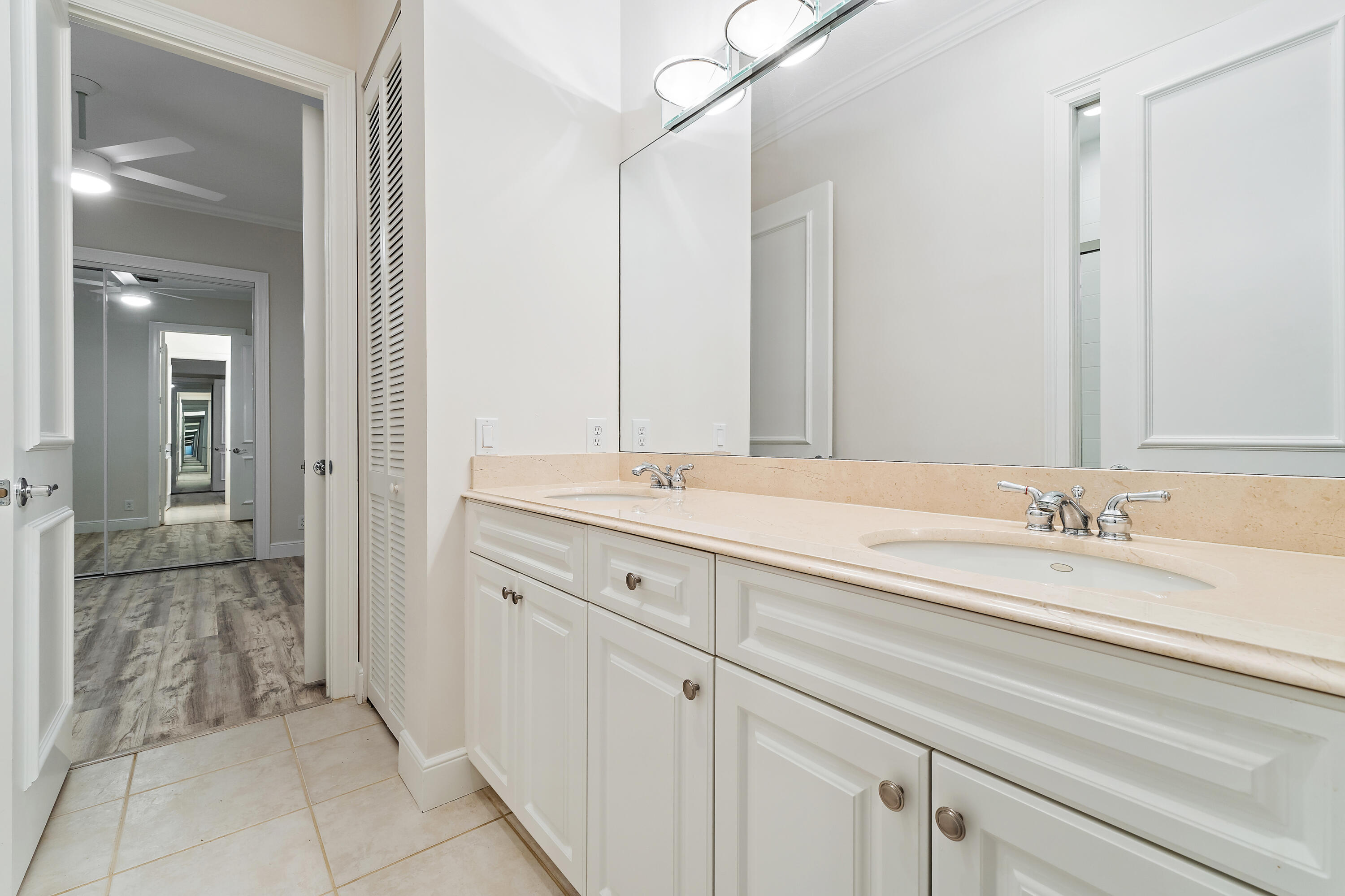 111 Fishermans Way Jupiter, FL 33477 - Photo 38 of 57 a bathroom with a sink and a mirror