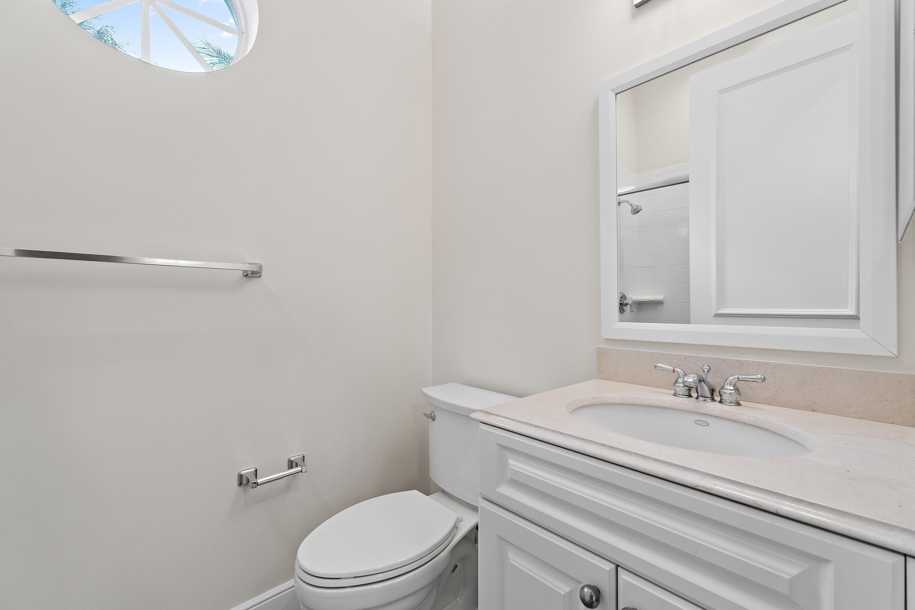 111 Fishermans Way Jupiter, FL 33477 - Photo 49 of 57 a bathroom with a granite countertop sink a toilet and a mirror