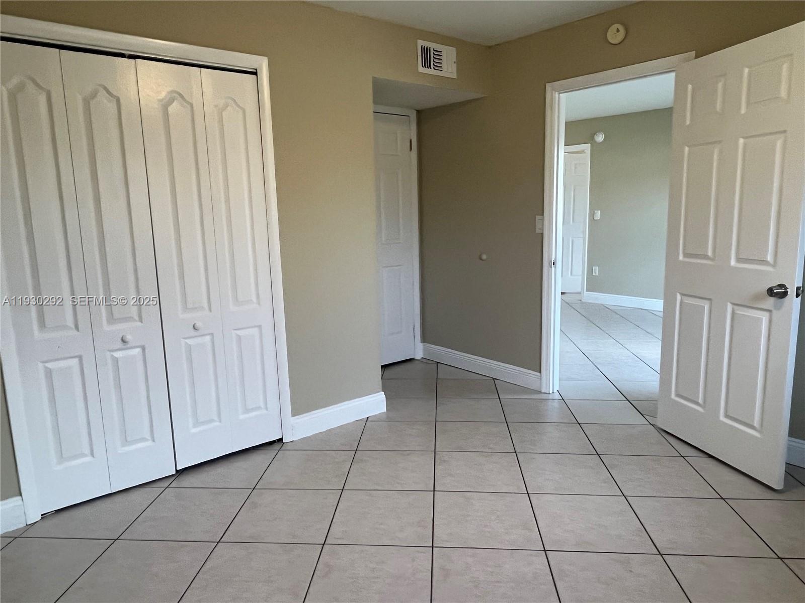 6091 West 22nd Court, Unit 101 Hialeah, FL 33016 - Photo 11 of 15 Large Bedroom with private bathroom