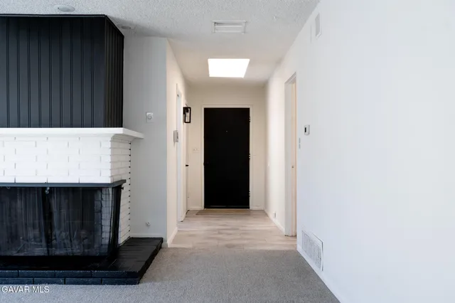 a view of a utility room with mirror