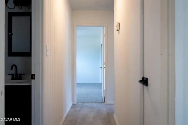 a view of a hallway with closet