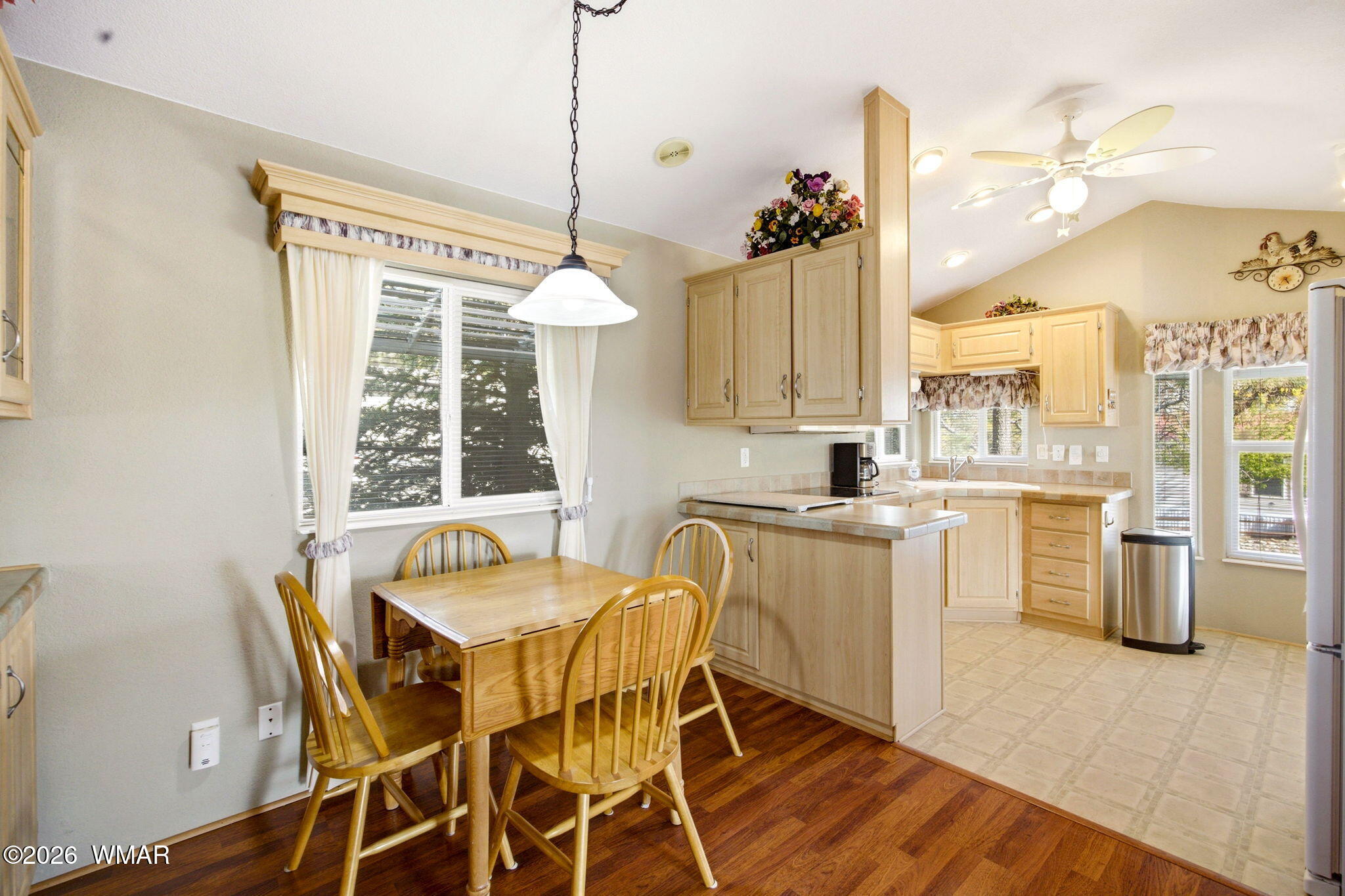 2275 Old Crooks Trail Overgaard, AZ 85933 - Photo 8 of 24 a kitchen with a table chairs sink and cabinets