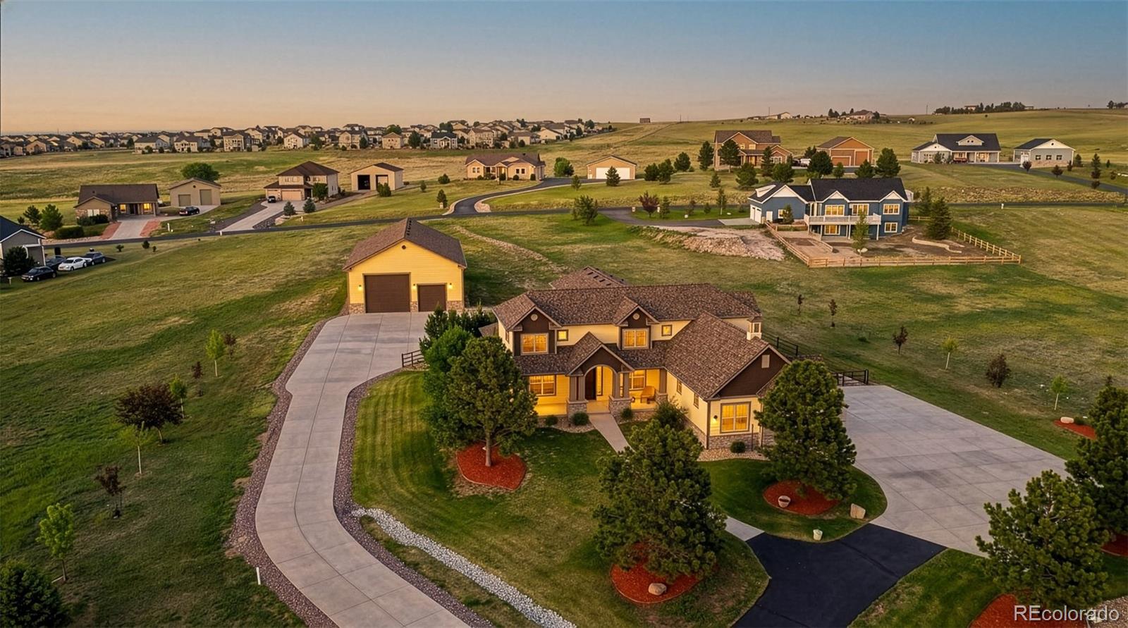 41865 East Muirfield Loop Elizabeth, CO 80107 - Photo 5 of 50 an aerial view of a house with a lake view