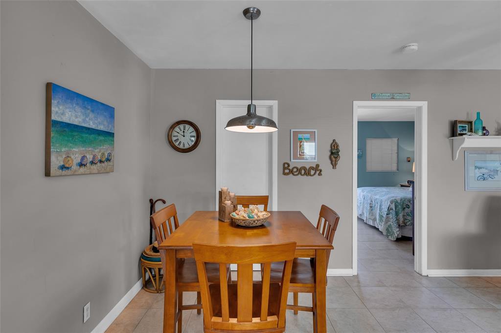 11 Southwest 4th Avenue, Unit 11 Boca Raton, FL 33432 - Photo 11 of 39 a view of a dining room with furniture and wooden floor