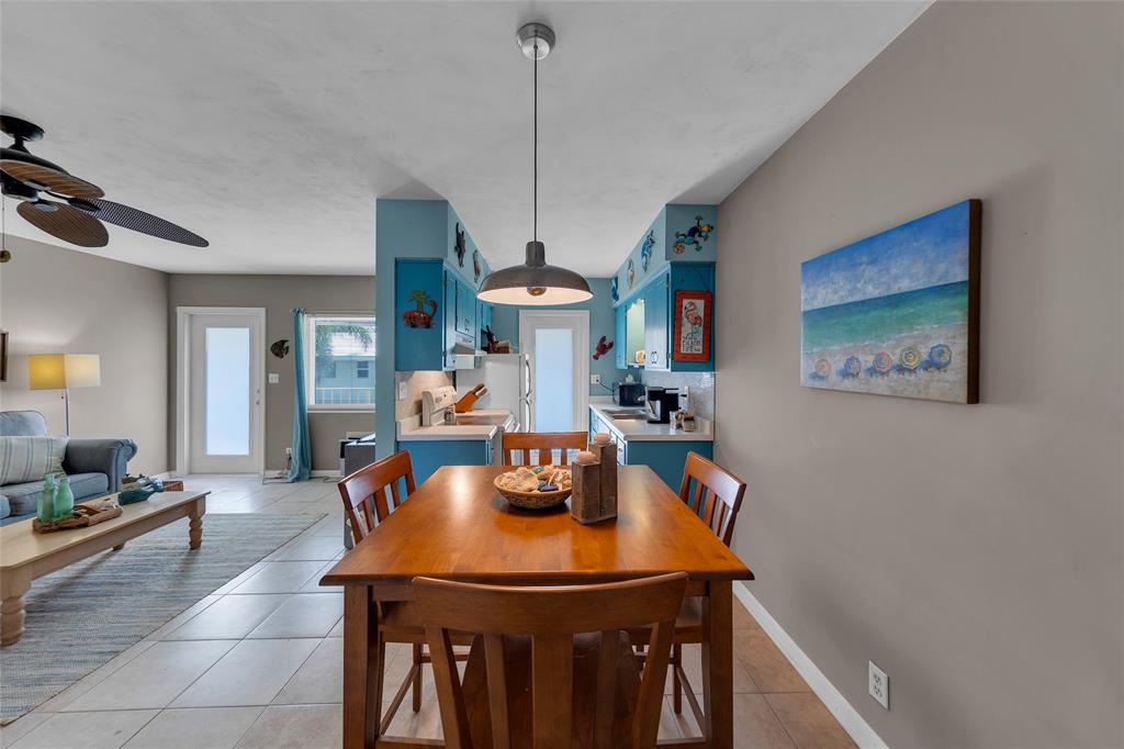 11 Southwest 4th Avenue, Unit 11 Boca Raton, FL 33432 - Photo 13 of 39 a view of a dining room with furniture and chandelier