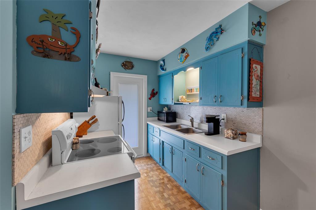 11 Southwest 4th Avenue, Unit 11 Boca Raton, FL 33432 - Photo 14 of 39 a bathroom with a sink mirror and cabinets