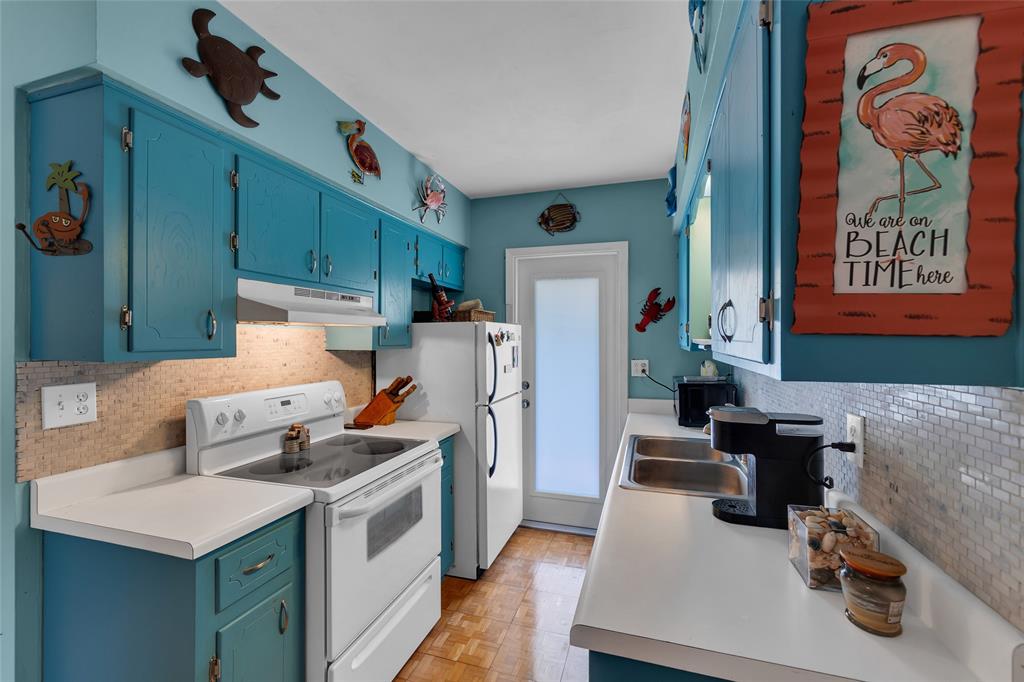 11 Southwest 4th Avenue, Unit 11 Boca Raton, FL 33432 - Photo 16 of 39 a kitchen that has a lot of cabinets and refrigerator
