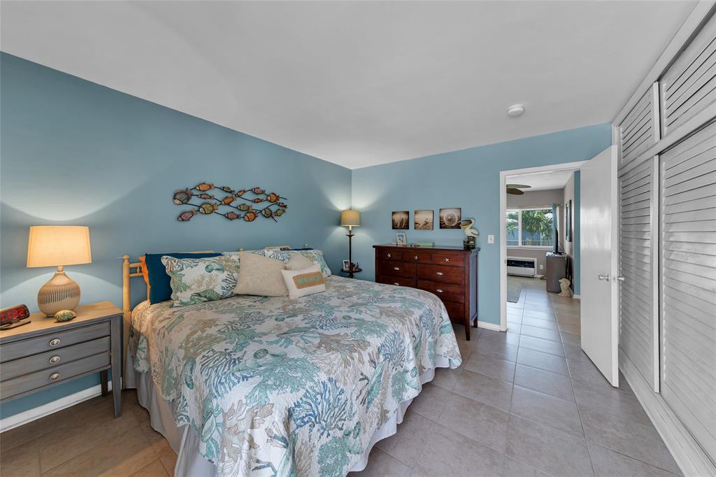 11 Southwest 4th Avenue, Unit 11 Boca Raton, FL 33432 - Photo 21 of 39 a bedroom with a bed and a view of bedroom