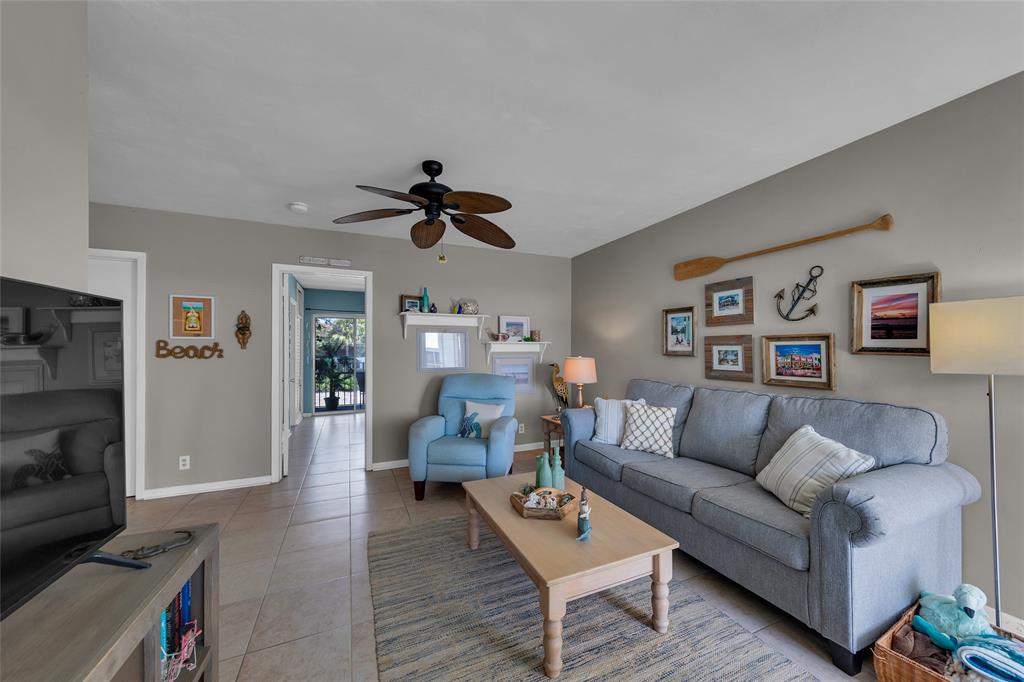 11 Southwest 4th Avenue, Unit 11 Boca Raton, FL 33432 - Photo 5 of 39 a living room with furniture and a flat screen tv