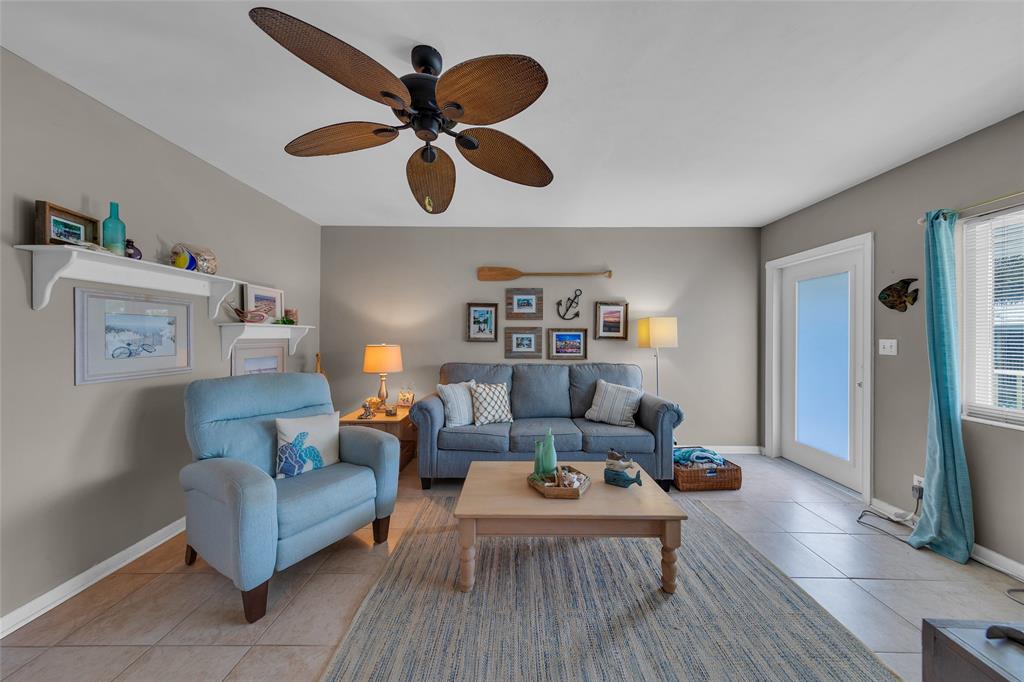 11 Southwest 4th Avenue, Unit 11 Boca Raton, FL 33432 - Photo 6 of 39 a living room with furniture and a large window