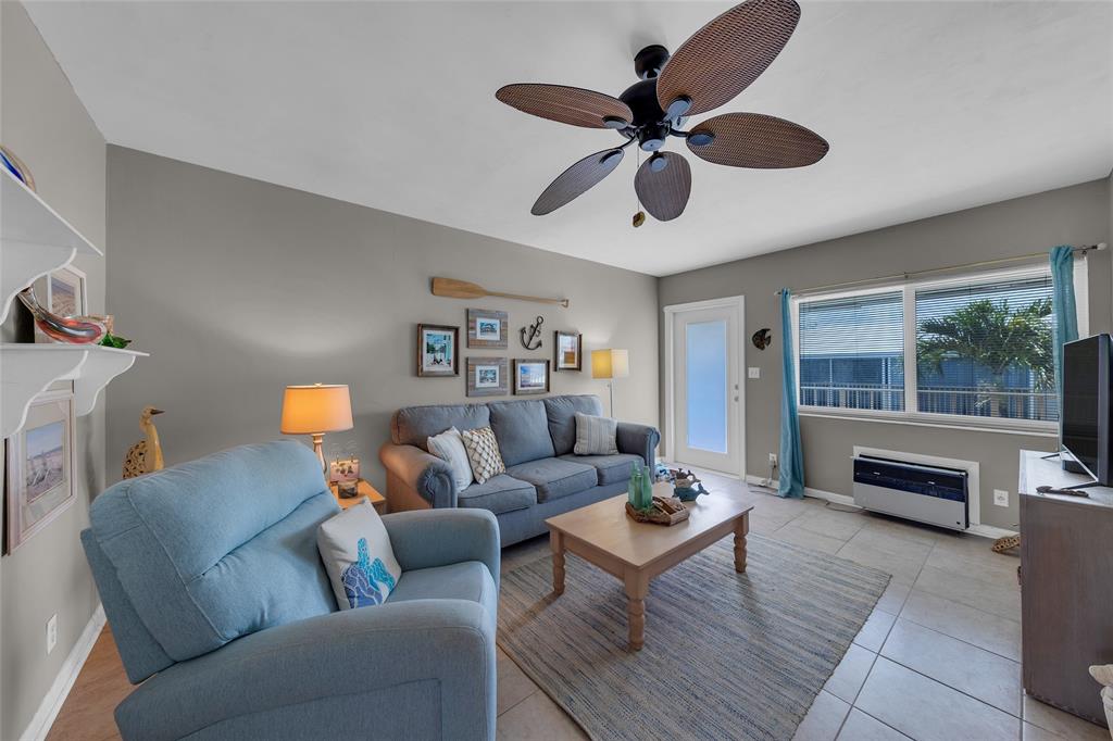 11 Southwest 4th Avenue, Unit 11 Boca Raton, FL 33432 - Photo 7 of 39 a living room with furniture and a wooden floor