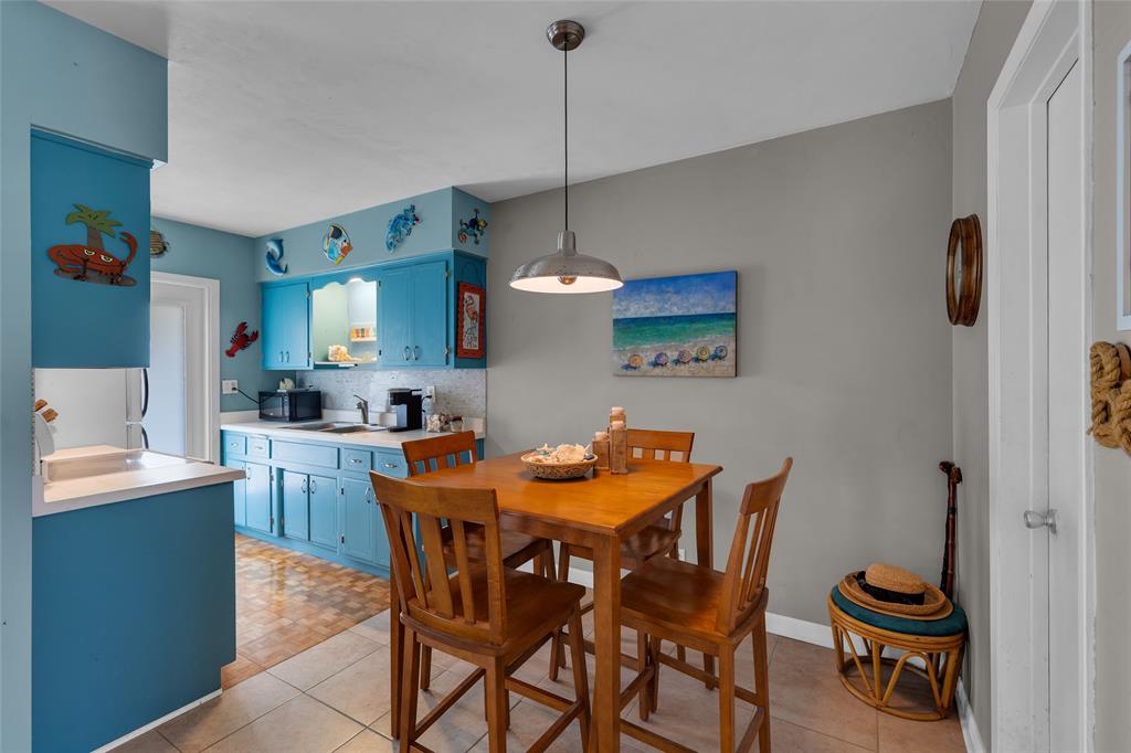 11 Southwest 4th Avenue, Unit 11 Boca Raton, FL 33432 - Photo 9 of 39 a dining room with furniture and window