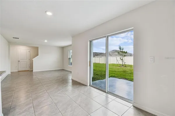 a view of empty room with floor to ceiling window