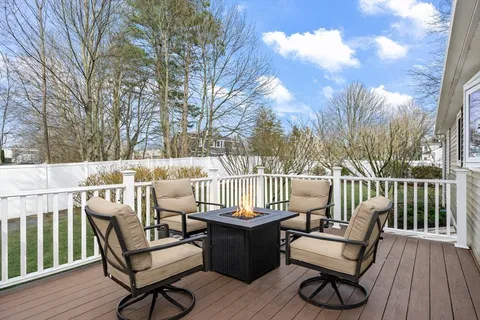 a view of a chairs and tables on the deck
