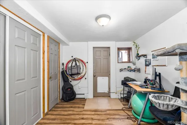 a living room with furniture and a mirror