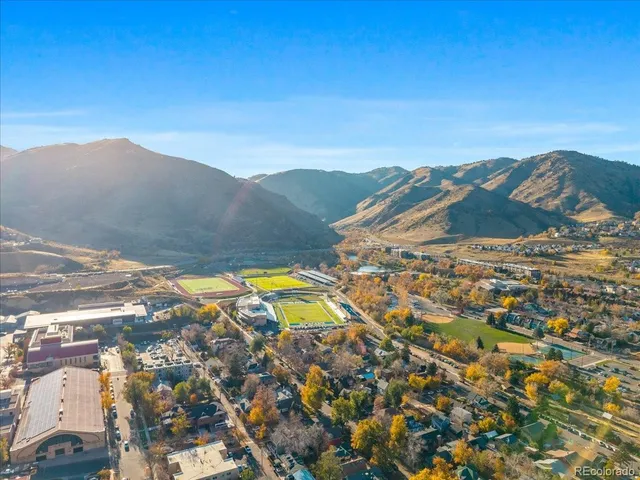 an aerial view of residential building and ocean view
