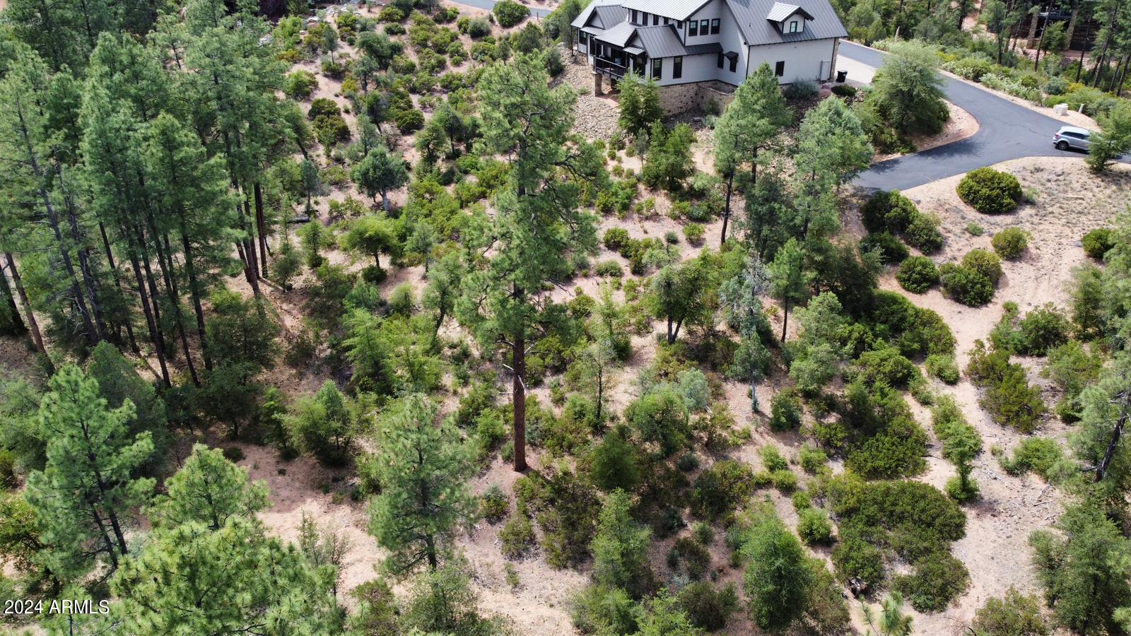 3009 East Arrow Point, Unit 241 Payson, AZ 85541 - Photo 2 of 13 an aerial view of residential house with parking and yard