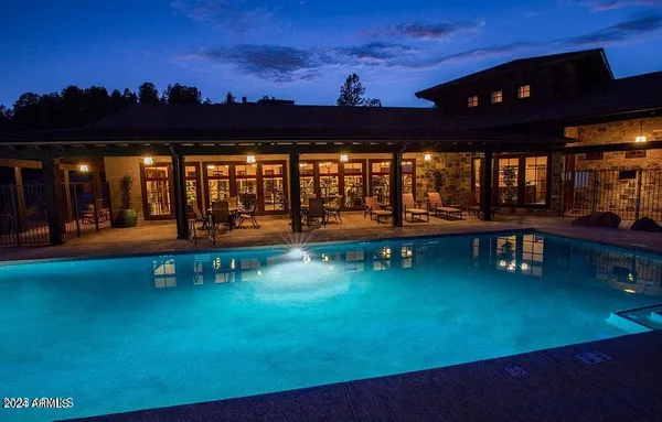 swimming pool view with a garden space