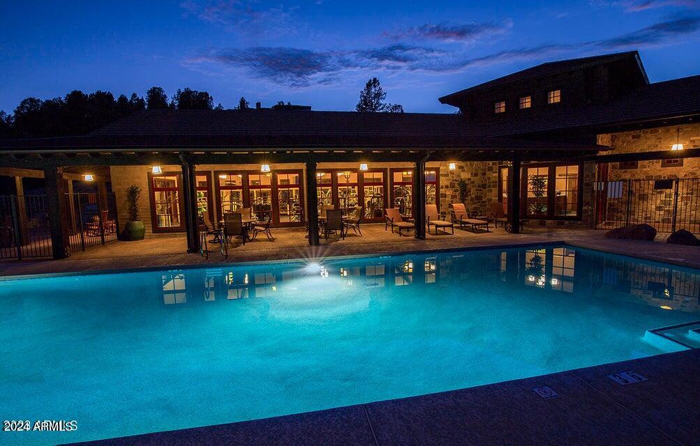 3009 East Arrow Point, Unit 241 Payson, AZ 85541 - Photo 8 of 13 swimming pool view with a garden space
