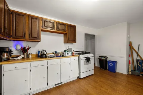 a kitchen with stainless steel appliances granite countertop a sink and cabinets