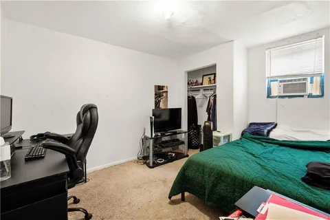 a view of a workspace with furniture and gym equipment