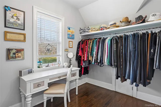 a view of a dining room with furniture closet and window