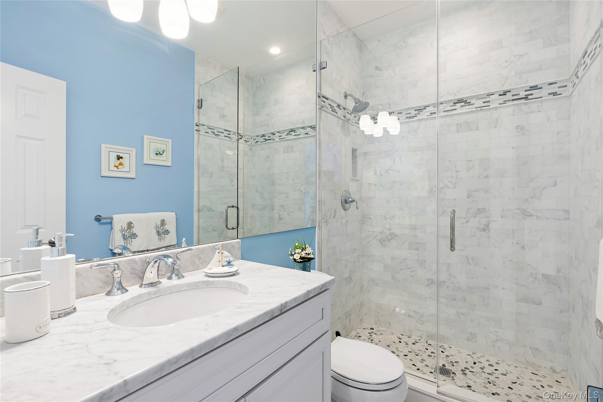 106 East Tiana Road Hampton Bays, NY 11946 - Photo 17 of 28 a bathroom with a sink a toilet and shower