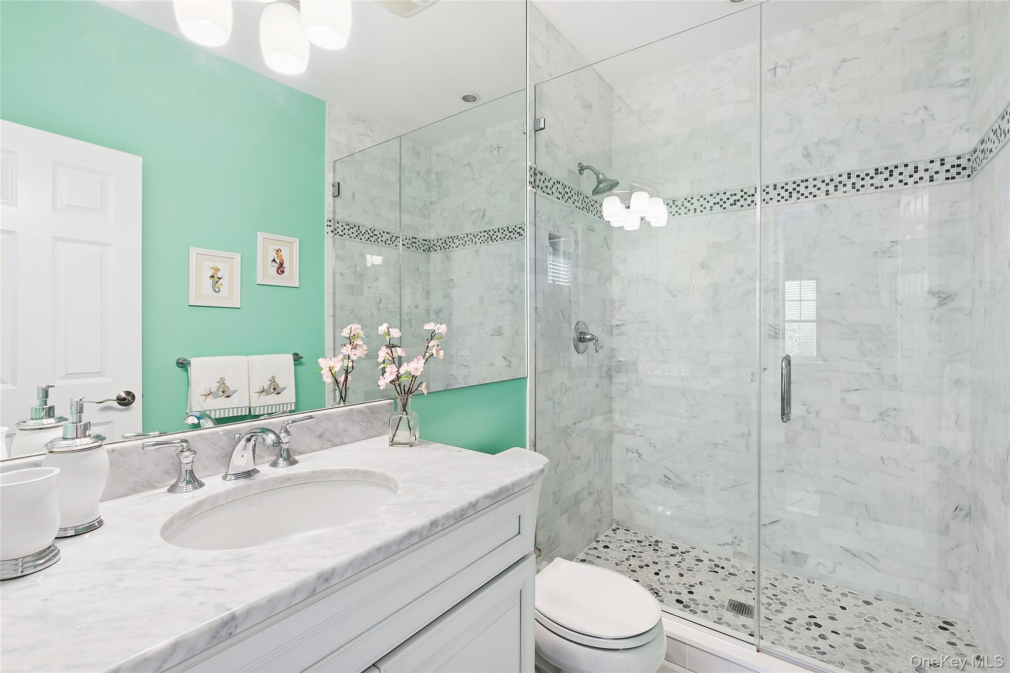 106 East Tiana Road Hampton Bays, NY 11946 - Photo 21 of 28 a bathroom with a granite countertop sink a toilet and shower