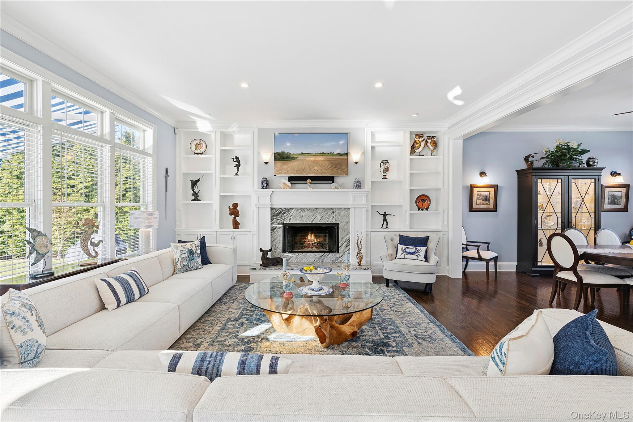 106 East Tiana Road Hampton Bays, NY 11946 - Photo 4 of 28 a living room with furniture fireplace and flat screen tv