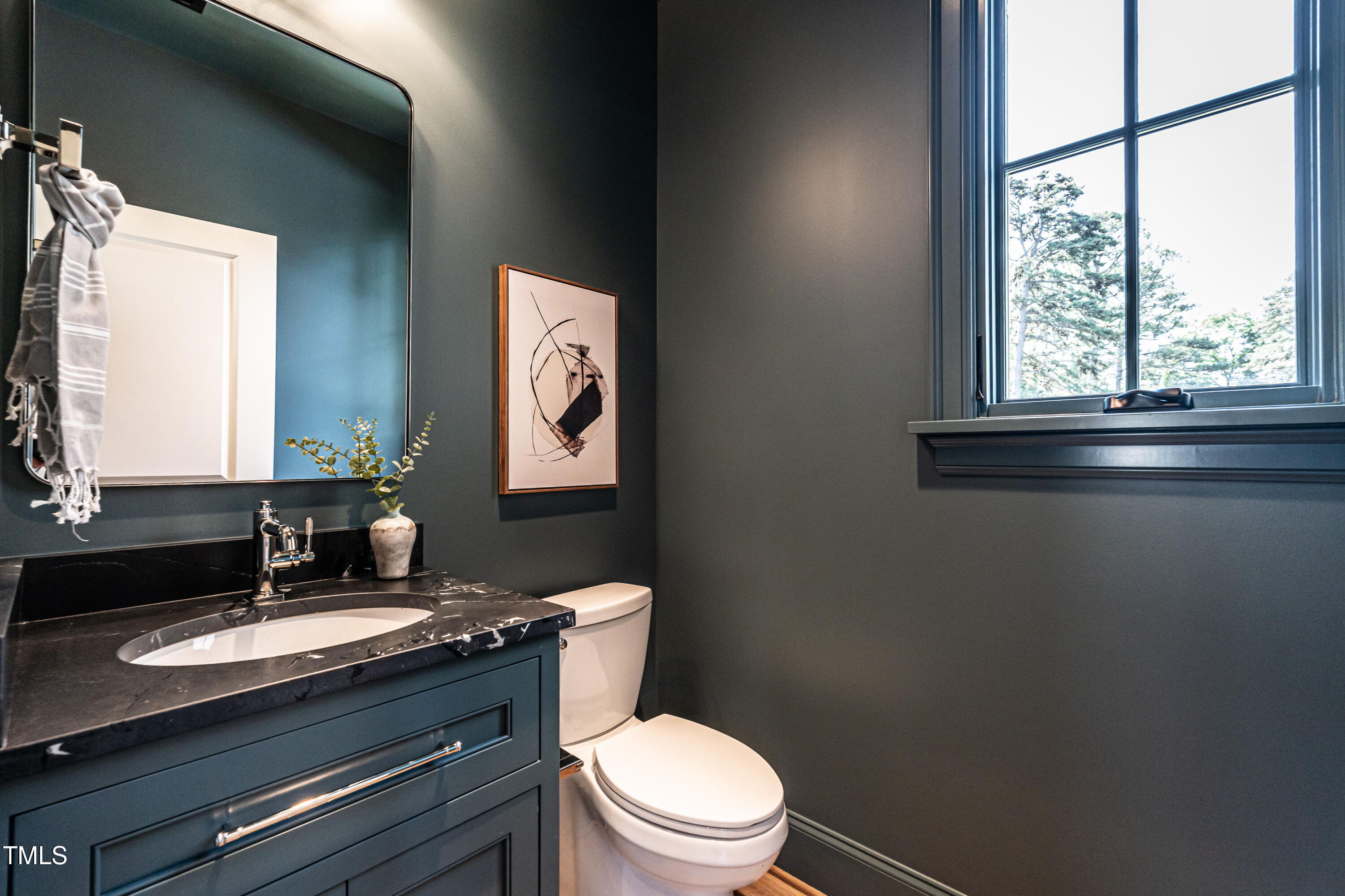 1222 Duplin Road Raleigh, NC 27607 - Photo 30 of 39 a bathroom with a granite countertop toilet sink and mirror