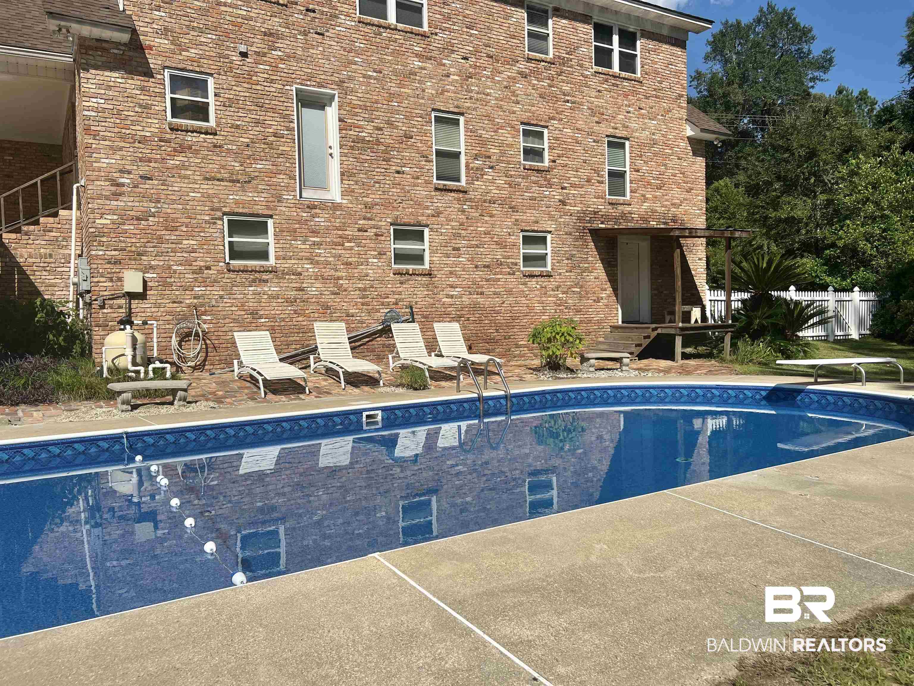 2691 Appleton Road Brewton, AL 36426 - Photo 47 of 60 Swimming pool with a patio and a diving board