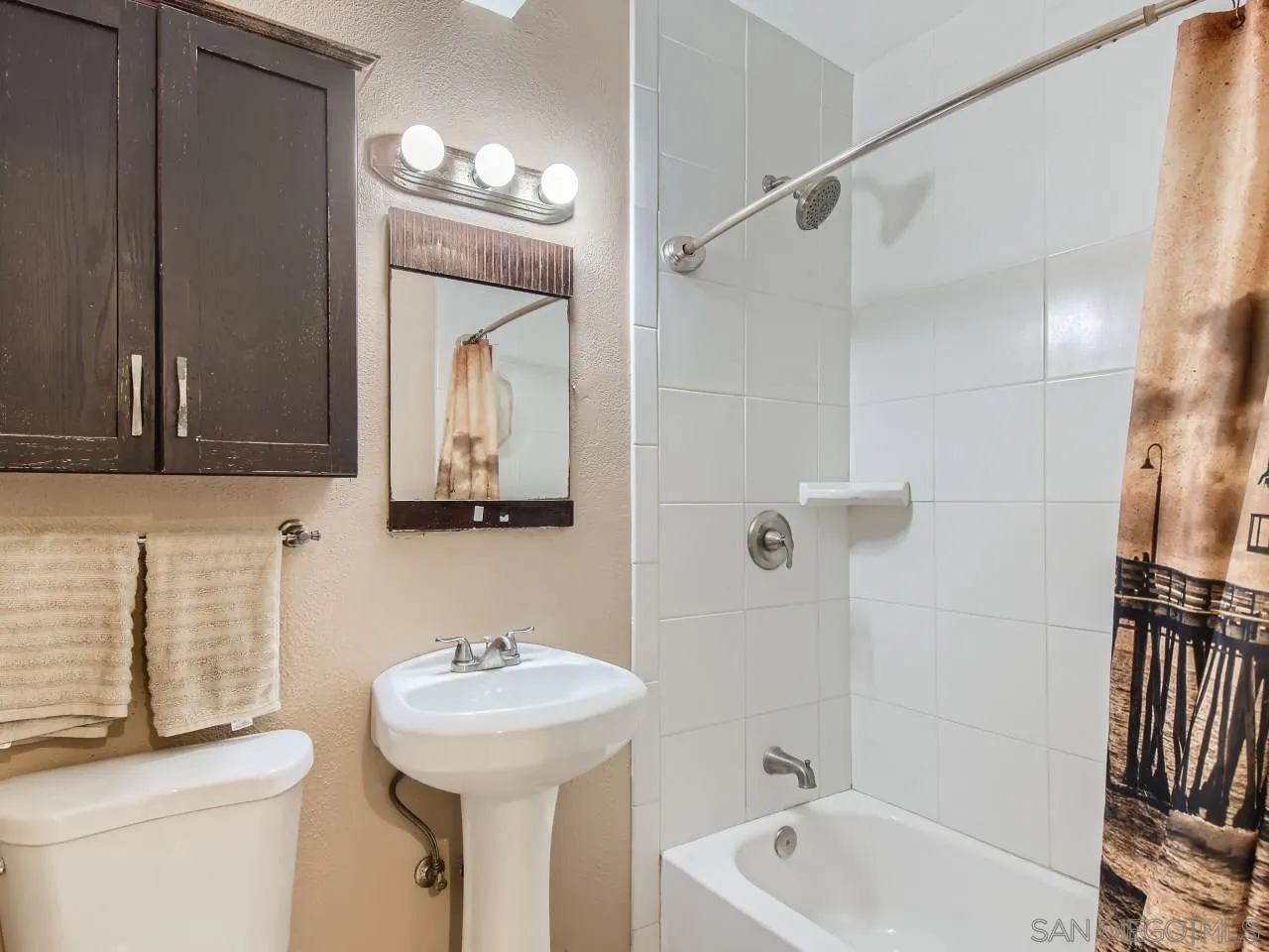 1401 9th Street Imperial Beach, CA 91932 - Photo 13 of 26 a bathroom with a sink and a mirror