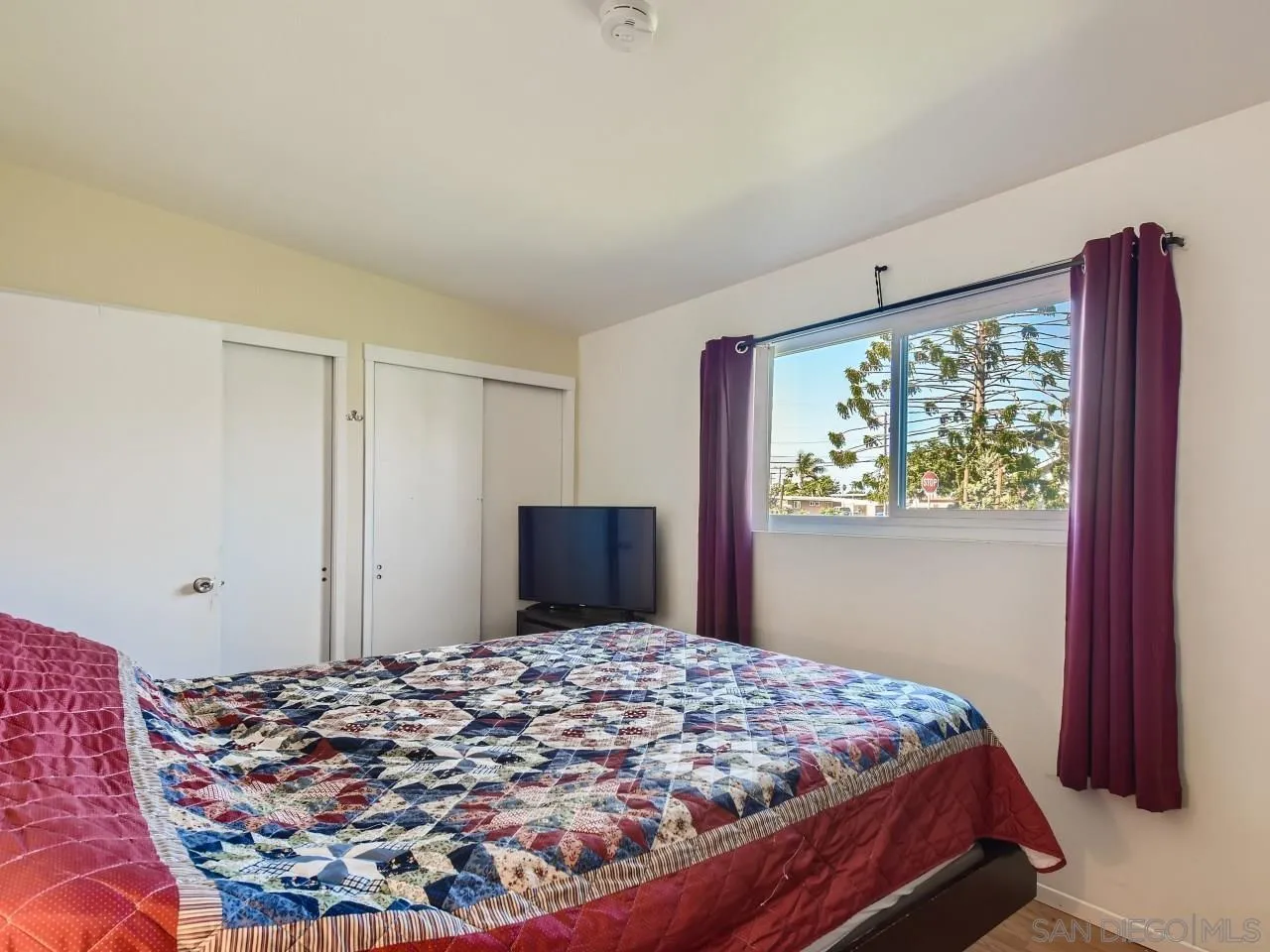 1401 9th Street Imperial Beach, CA 91932 - Photo 14 of 26 a bed sitting in a bedroom next to a window