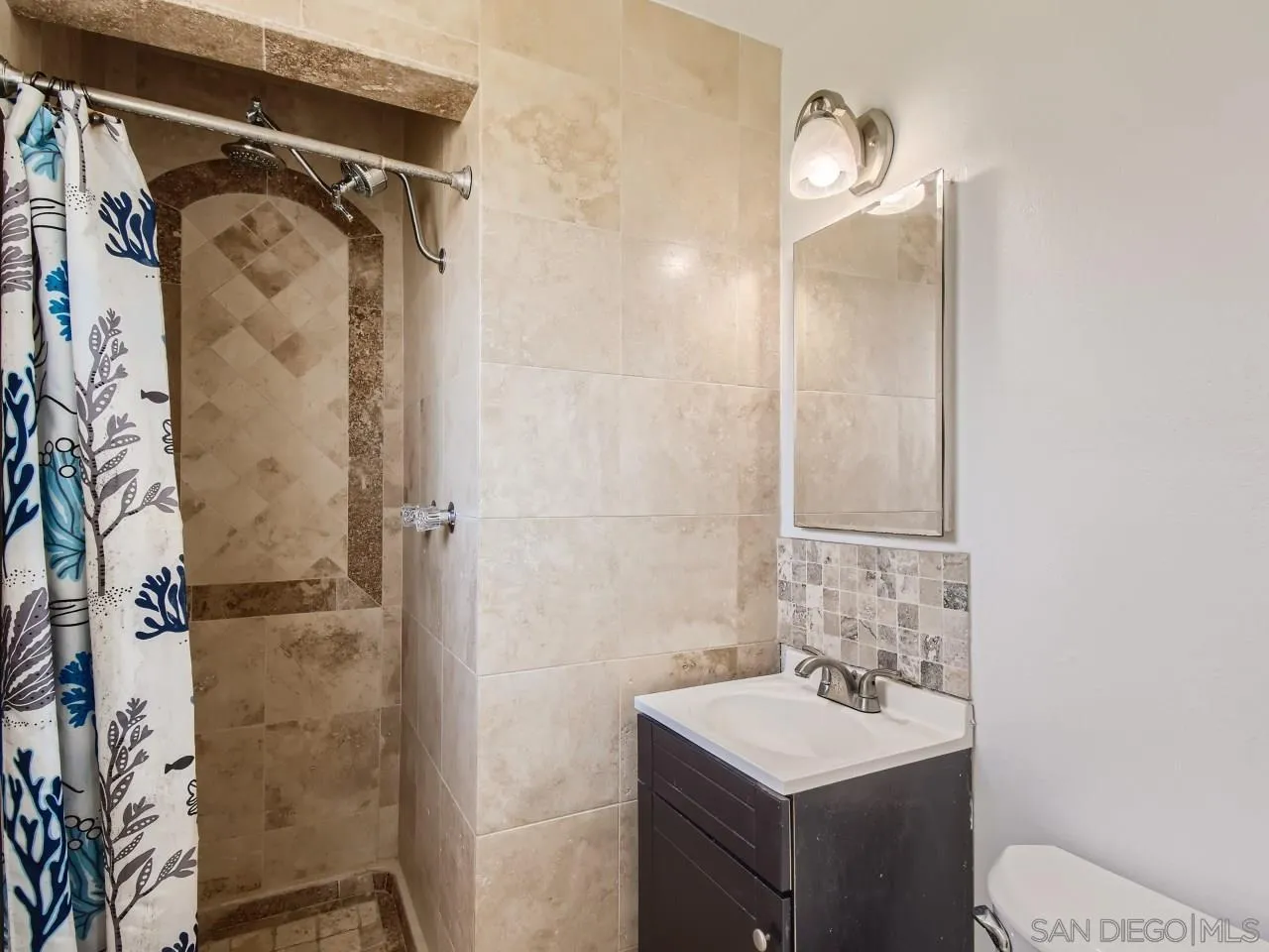 1401 9th Street Imperial Beach, CA 91932 - Photo 16 of 26 a bathroom with a sink toilet and shower