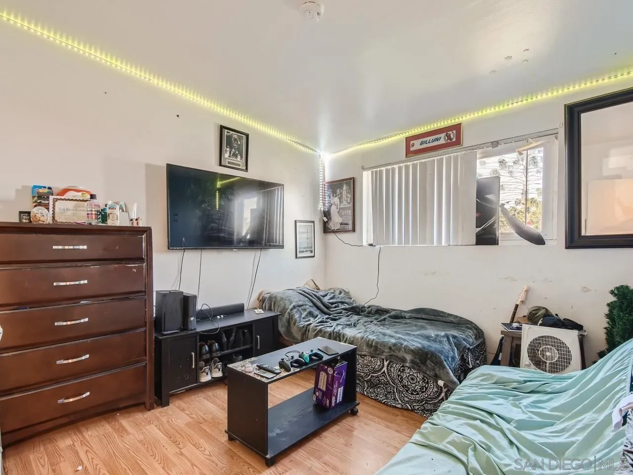 1401 9th Street Imperial Beach, CA 91932 - Photo 17 of 26 a living room with furniture and a flat screen tv