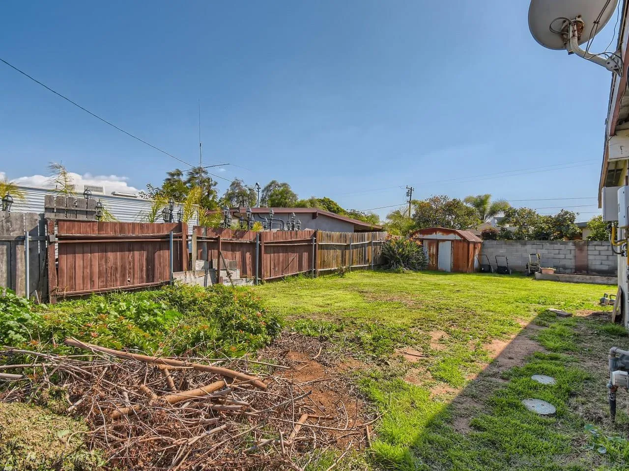 1401 9th Street Imperial Beach, CA 91932 - Photo 24 of 26 a backyard of a house with lots of green space and fountain