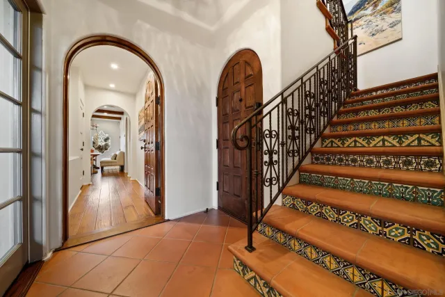 a kitchen with stainless steel appliances kitchen island granite countertop a stove a sink and a refrigerator
