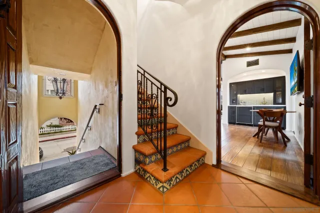 a large kitchen with a table and chairs
