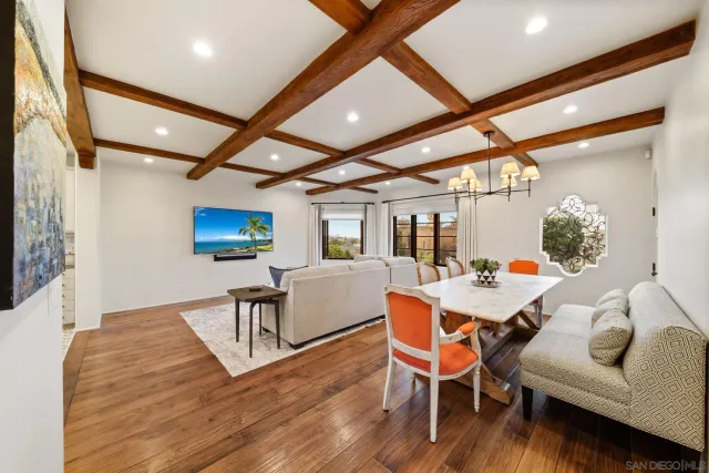 a view of a porch with furniture and floor to ceiling window