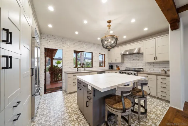 a spacious bathroom with a shower sink and mirror