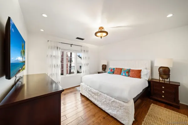 a kitchen with stainless steel appliances granite countertop a stove a sink dishwasher and cabinets with wooden floor